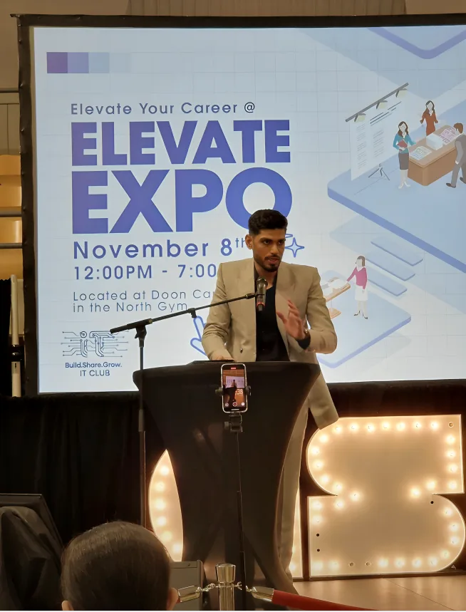 Girish Bhuteja speaking at the IT Club's Elevate Expo career event